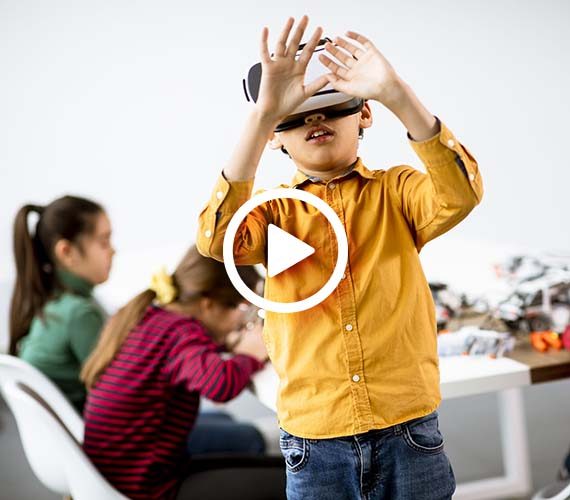 cute-little-boy-wearing-vr-virtual-reality-glasses-robotics-classroom-scaled